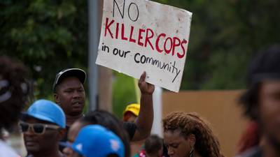 Rioting after black teen shot dead by police   in Missouri
