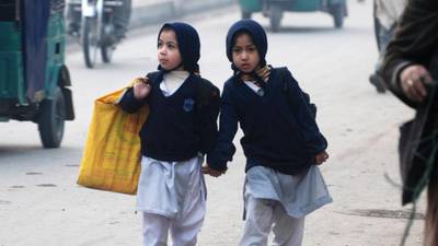 Children return to Pakistani school a month after massacre