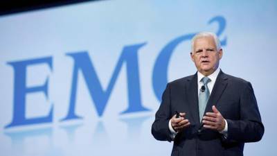 EMC  cuts profit forecast, citing stronger dollar