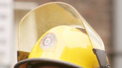 Fireman sued after his helmet fell out of his locker and hit him on the head