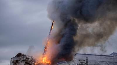 Spire collapses as fire breaks out at Copenhagen’s historic Old Stock Exchange