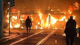 Dublin bus and Luas set alight during violent clashes in Dublin following stabbing