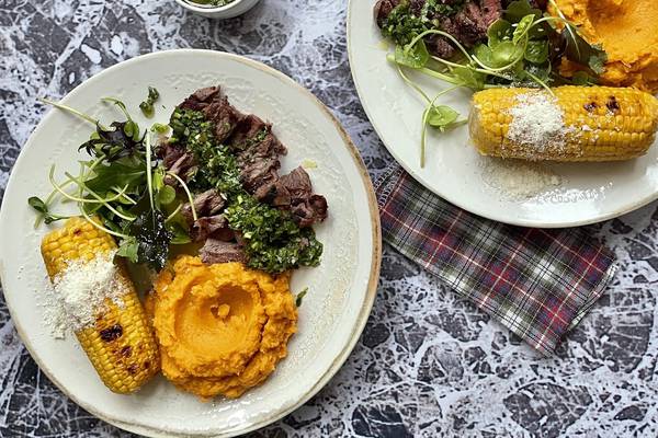 Barbecued steak with chimichurri and sweet potato