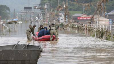 At least 40 dead as torrential rains hit southern Japan