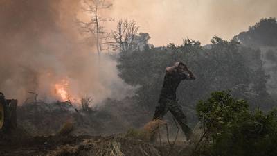 Two firefighters killed battling blaze on Greek island as wildfires continue across Mediterranean
