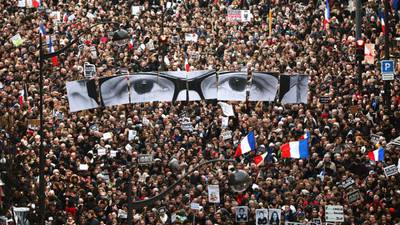 Defiance and fraternity as millions march in France