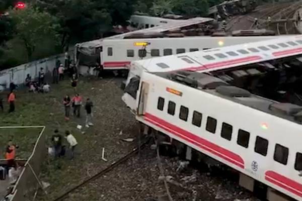 At least 18 people killed after train derails in Taiwan