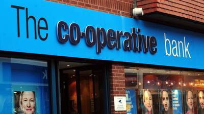 Co-operative Bank narrows losses