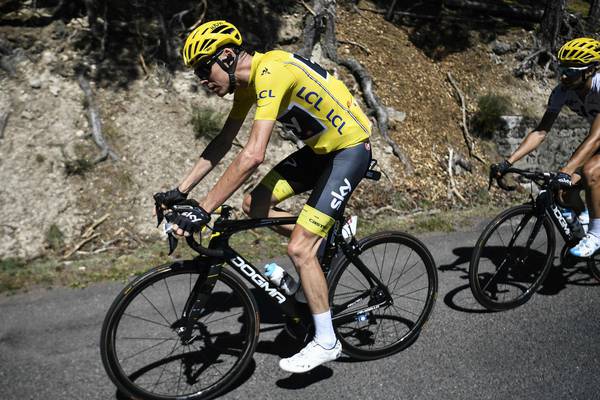 Tour de France: Chris Froome retains yellow jersey despite puncture