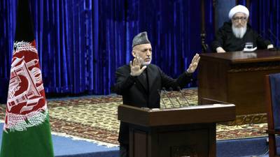 Karzai advises Afghans to approve pact under which US forces will stay in place