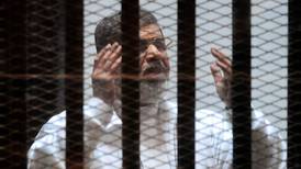 Egypt puts former president on trial for national security breach