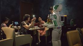 So mad about tech, China even loves its robot waiters that can’t serve