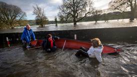 Tánaiste falls out of boat on visit to flooded Thomastown