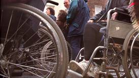 Wheelchair charity told to cease health insurance for spouses