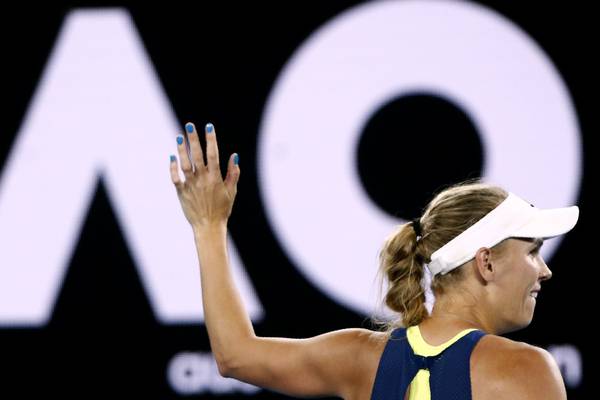 Caroline Wozniacki flickers on and off on way to semi-finals
