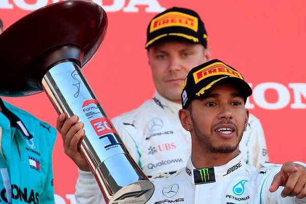Japan win puts Lewis Hamilton on verge of world title