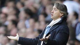 Renewed speculation about his job at Manchester City annoys Mancini