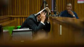 Pistorius retches in court as pictures of Steenkamp shown