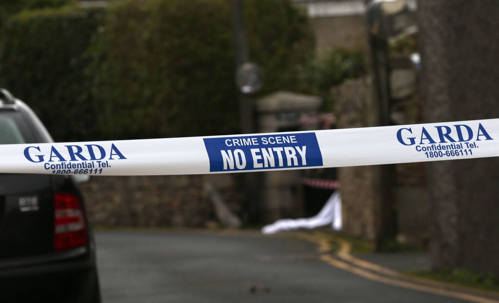 Gardai tape sealing off the scene where the body of a man was discovered on the ground near an apartment complex in Dalkey, Co Dublin. PRESS ASSOCIATION Photo. Picture date: Friday January 12th, 2018. Gardai said the scene had been sealed off to allow for a technical examination and the State Pathologist's office has been called in. See PA story POLICE Body Ireland. Photo credit should read: Laura Hutton/PA Wire