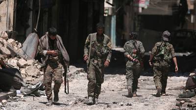 Syrian troops enter Kurdish-held town after Turkey threatens offensive