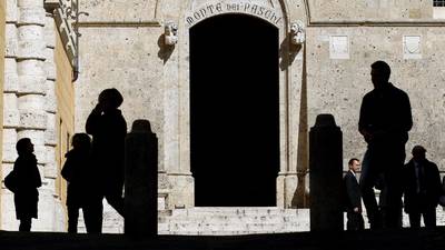 Italian bond yields hold near two-week lows after auction test