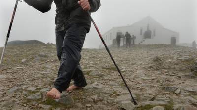 Pilgrims persevere in Croagh Patrick climb despite weather alert