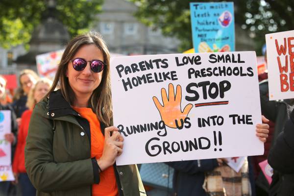 Minister defends record on childcare spending as protest is held outside Dáil