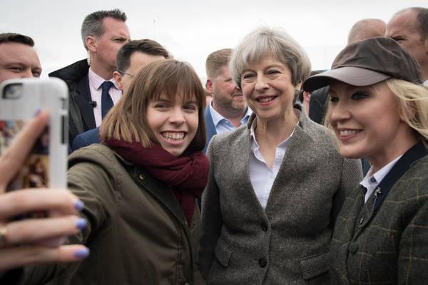May urges parties  to ‘come together’ during Northern Ireland  visit