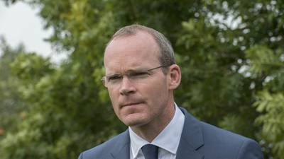 Coveney determined water charge freeze to last just nine months