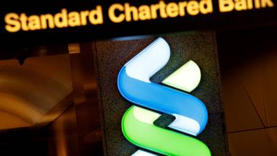 Standard Chartered sets aside $900m to cover US, British fines
