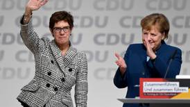 Tears and cheers as Merkel ally wins race to lead CDU party