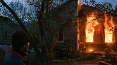 Nagorno-Karabakh: Russians on guard ahead of Azeri takeover as homes burn