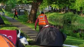 Days of asylum seekers living in encampments on Dublin streets for weeks are over, says Harris