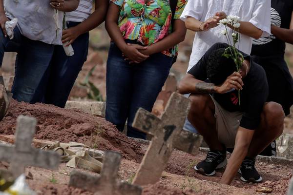 Bolsonaro refuses to address record daily total of Covid deaths in Brazil