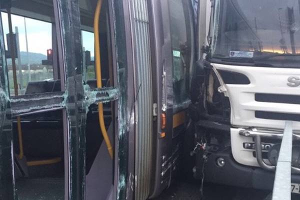 Two people hospitalised after crash between Luas and truck