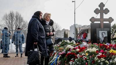 Navalny’s mother brings flowers to his grave a day after thousands attend funeral in Moscow