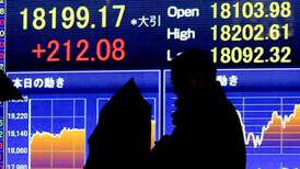 Surprise interest rate cut helps lift stocks across Asia