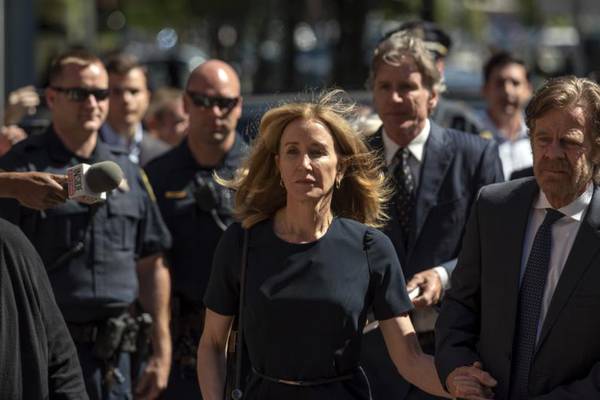 Felicity Huffman given 14 days in prison for part in US college admission scandal