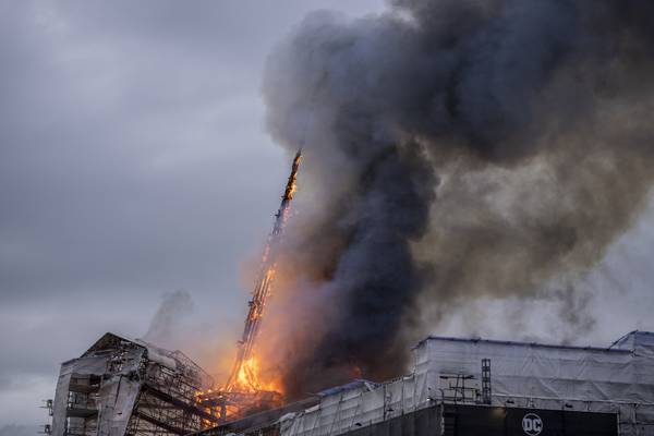 Spire collapses as fire breaks out at Copenhagen’s historic Old Stock Exchange