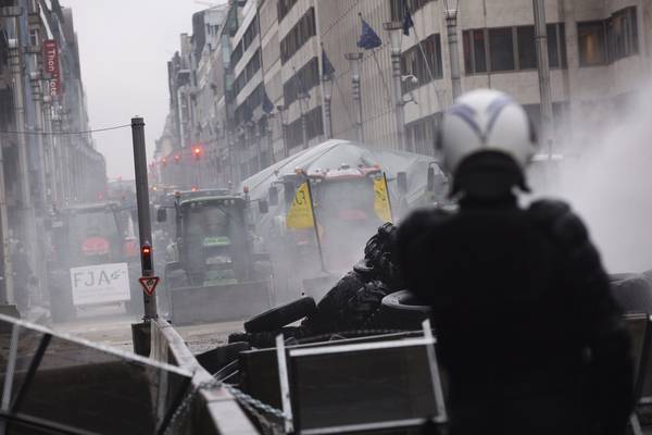 Disruption in Brussels as riot police use water cannon on protesting farmers