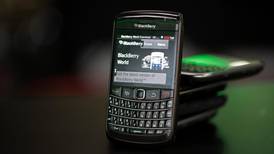 Fairfax head vows to complete BlackBerry deal