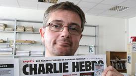 Irishman Paddy Sherlock sings at ‘Charlie Hebdo’ editor’s funeral