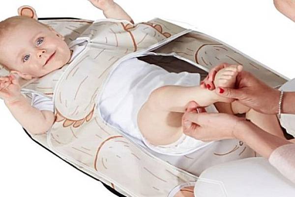 Anti-roll baby changing mat changes struggles to cuddles