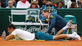 Tomic ends silence over father as he bows out of French Open with injury