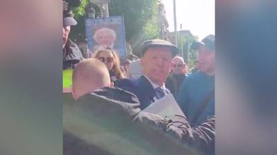 Gardaí escort Michael Healy-Rae from Kildare Street protests