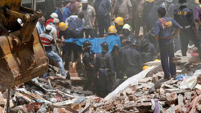 Mumbai building collapses as south Asia floods wreak havoc