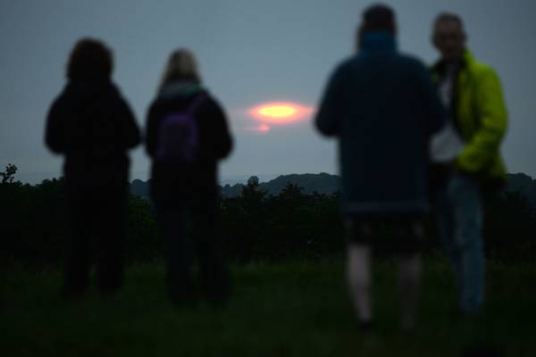 Crowds gather for summer solstice on the Hill of Tara