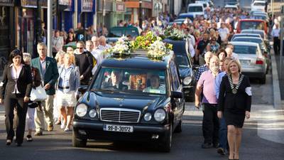 Castlebar falls silent in grief  at removal of brothers to local church