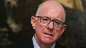 Charlie Flanagan returns  from US early following  death of  mother