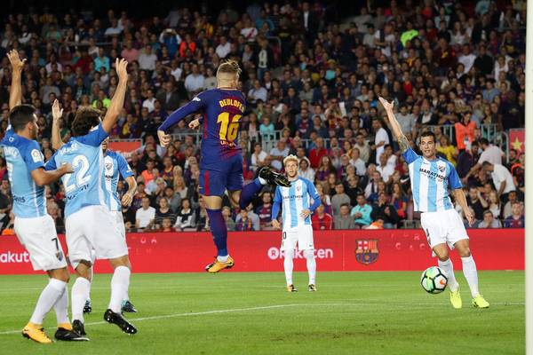 Controversial Deulofeu goal helps Barca beat Malaga